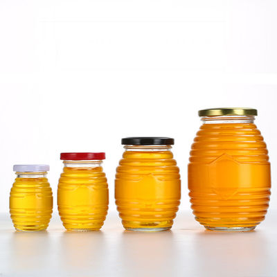 Η μορφή μελισσών βάζα λίγου γυαλιού, φαντάζεται περασμένος κλωστή γύρω από το βάζο γυαλιού με το καπάκι προμηθευτής